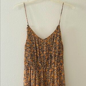 Smooth and slinky spring and summer dress with tiny orange flowers.